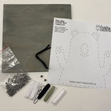 Bear Hug String Art Kit contents: nails, board, string, and instructions. Everything needed to create a beautiful DIY string art piece.